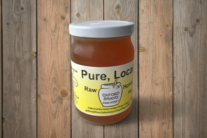 Jar of pure, local raw honey on a wooden background